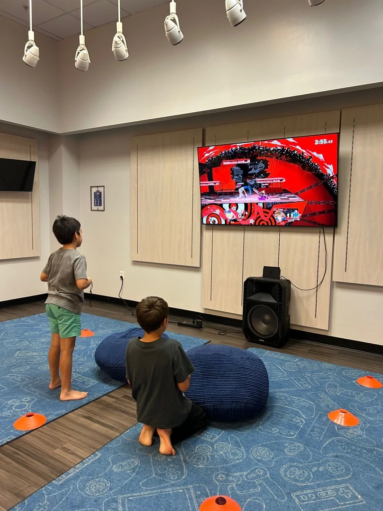 Two boys playing video games.