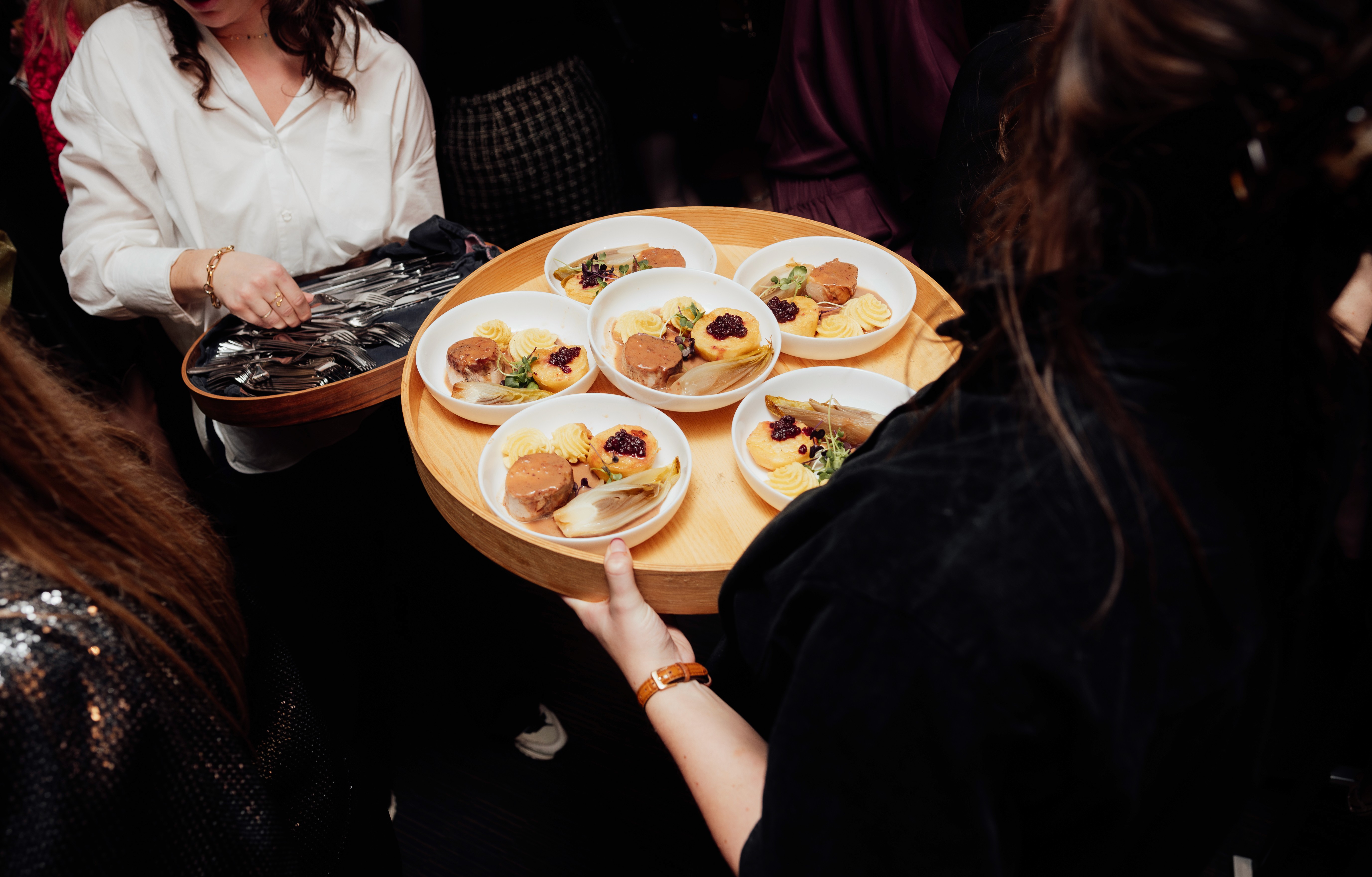 Waiter holding pizza boxes