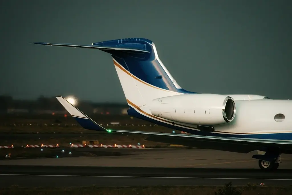 Aircraft framed by city buildings