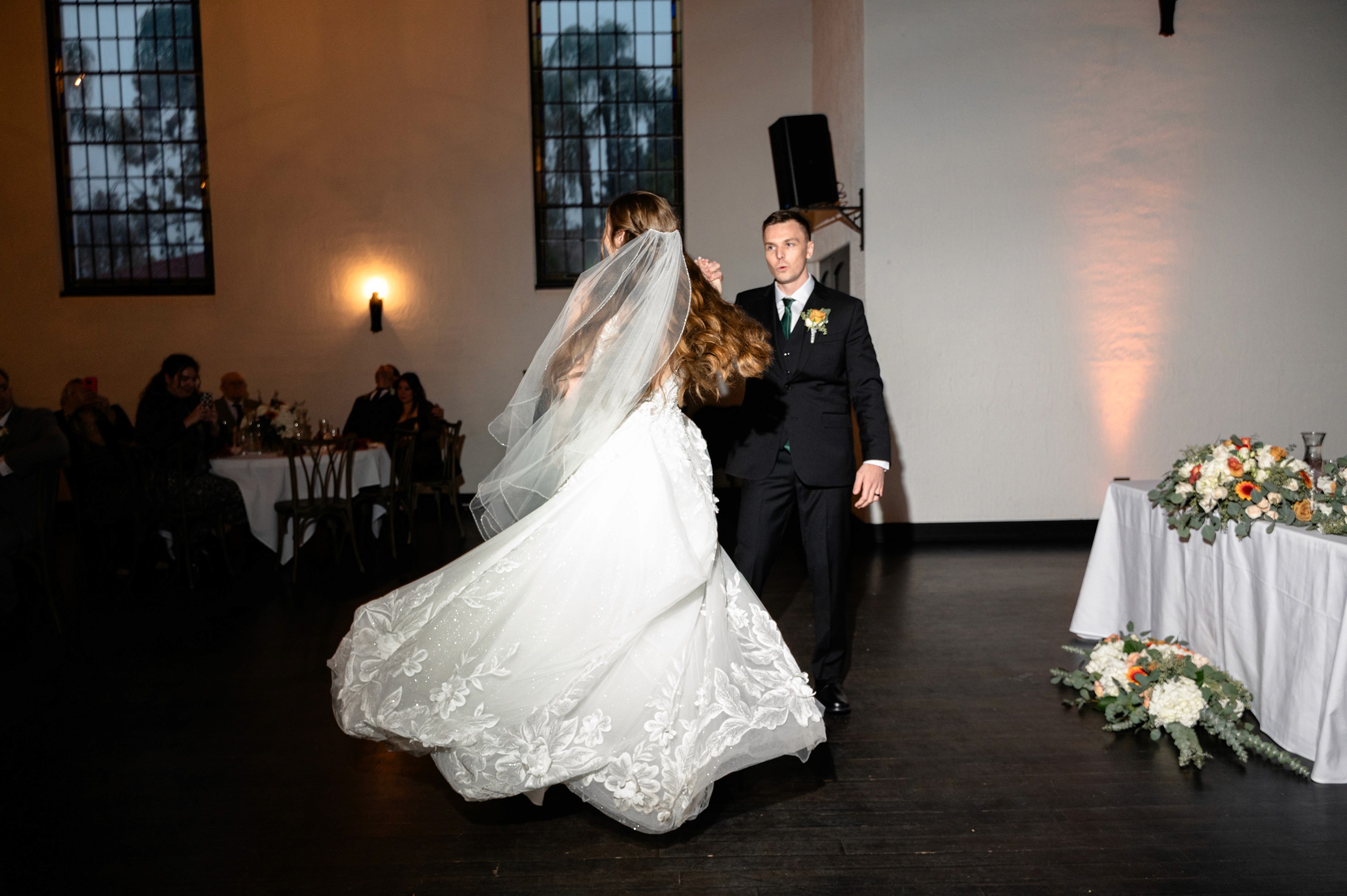 Flat lay wedding details with bouquet, rings, and sparkling bridal heels