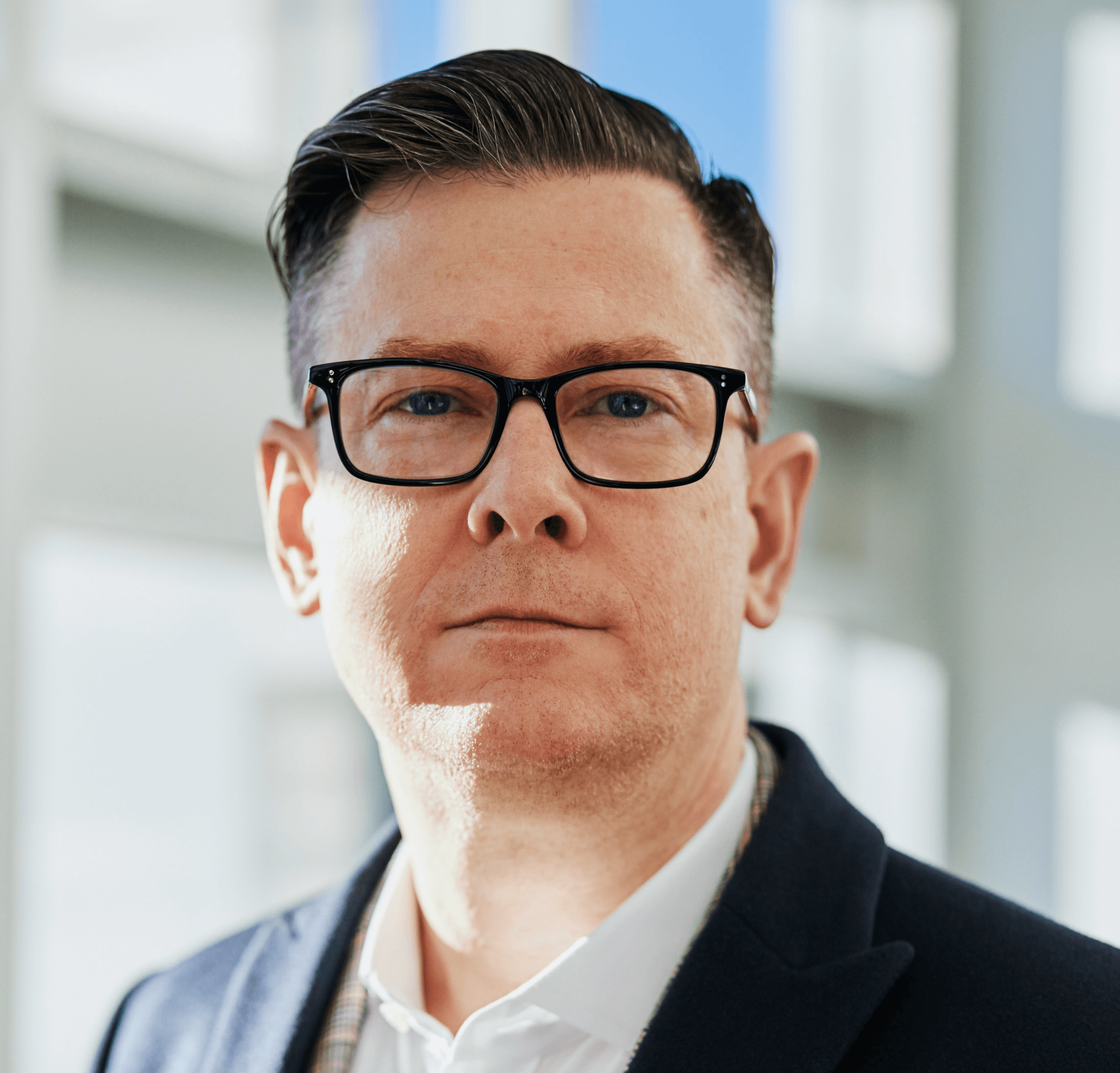 man standing beside wall