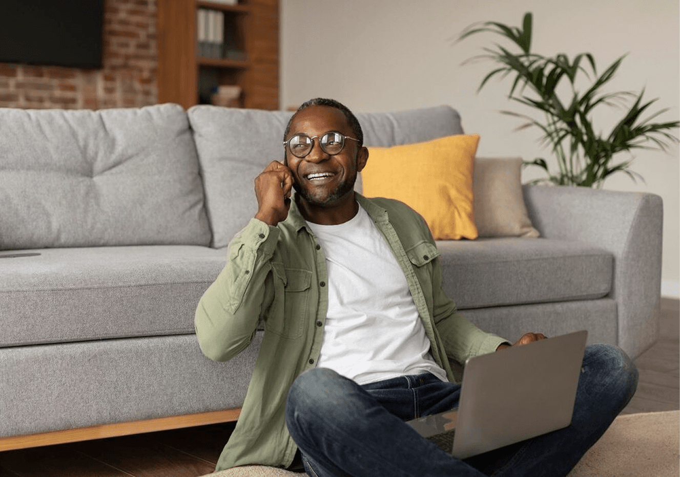 man in greeen on a hone call