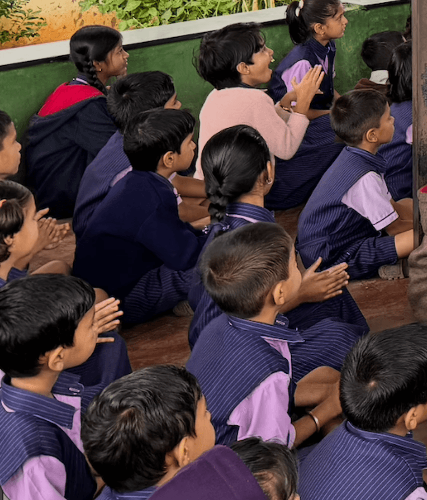 a little boy wearing a face mask and holding a box