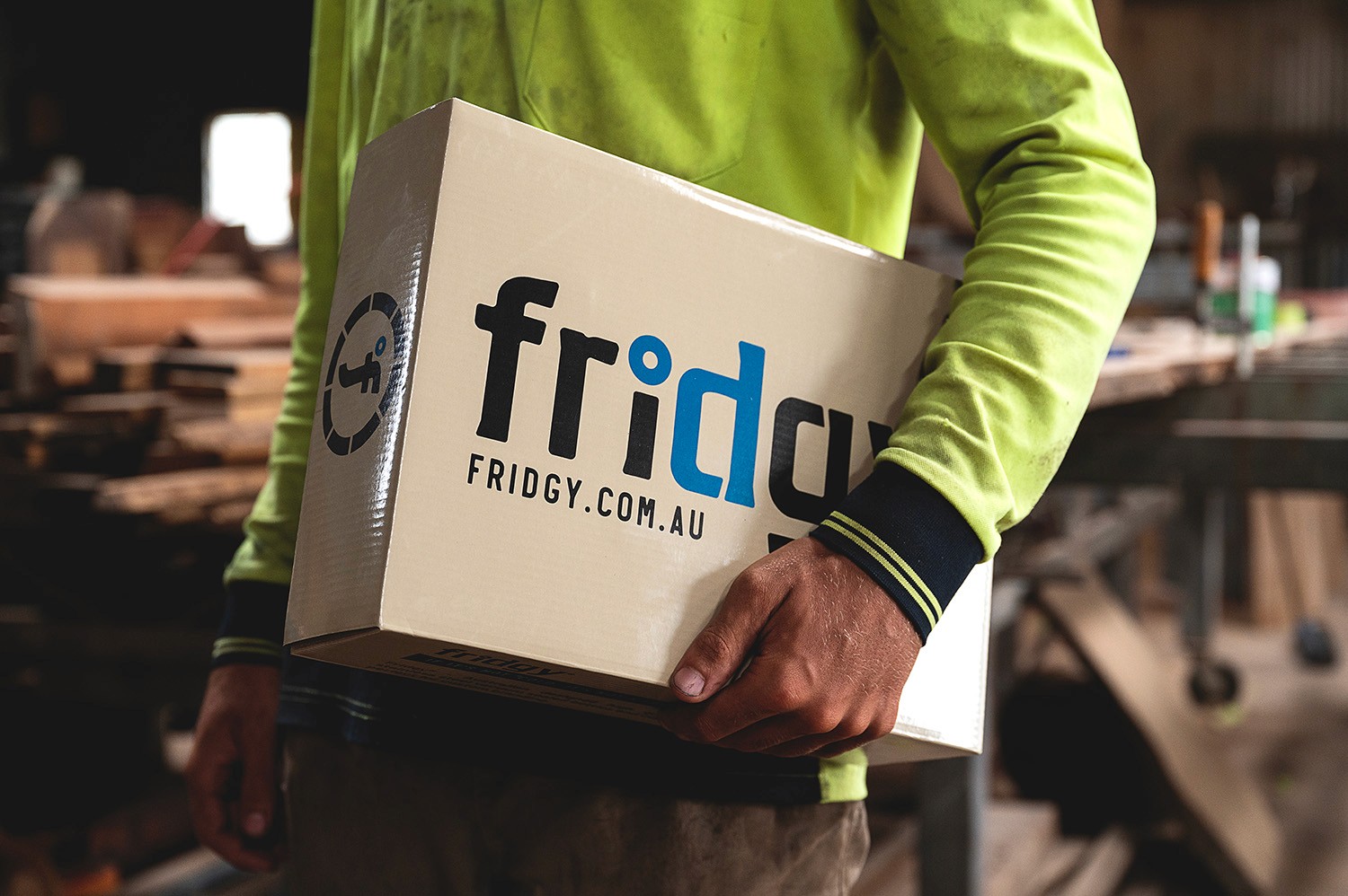 Sculptural chrome vase with a single red flower on white—minimal modern décor still life.
