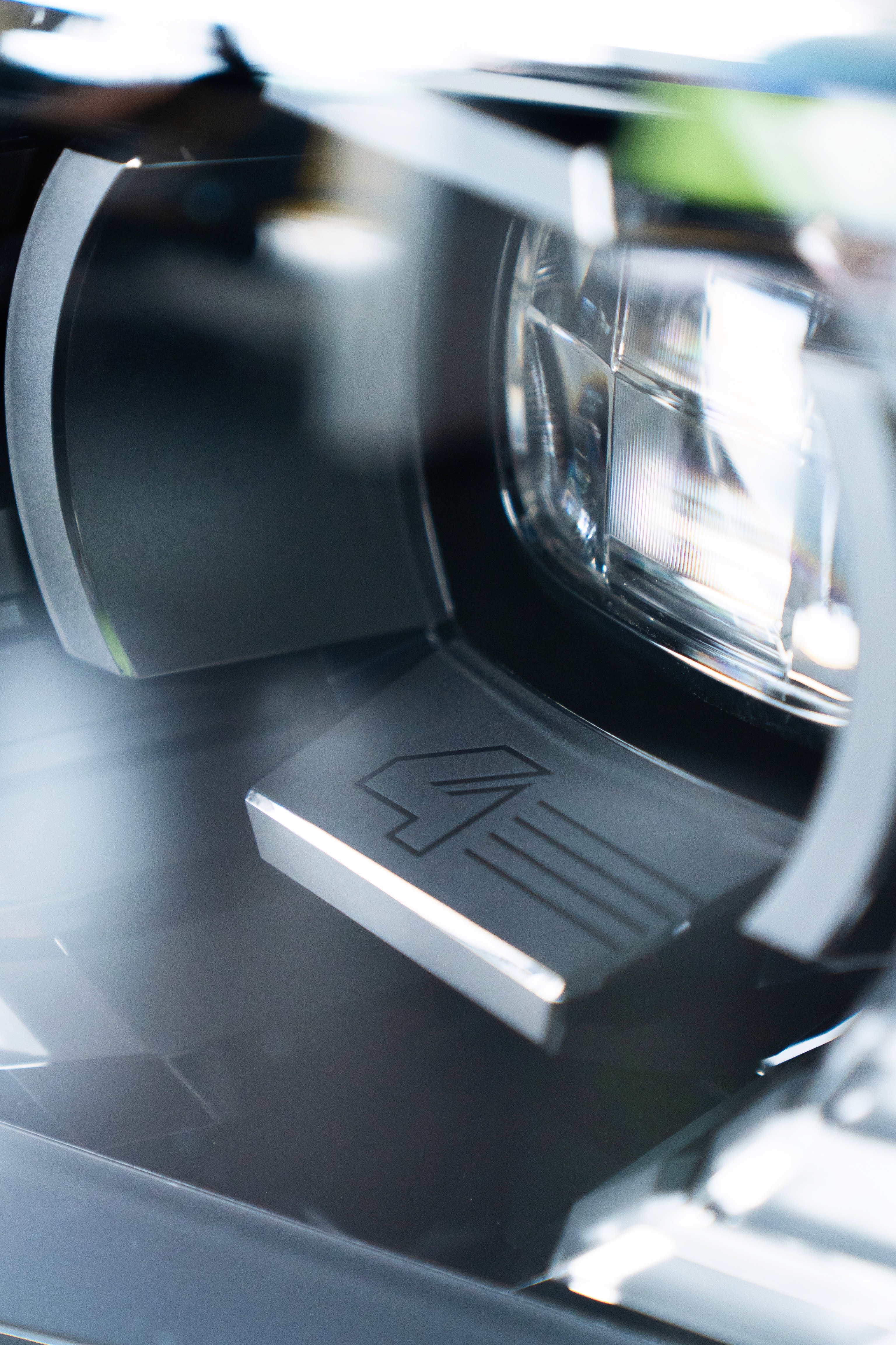  A woman with her eyes closed, wearing a helmet, appears to be in a moment of concentration or relaxation.