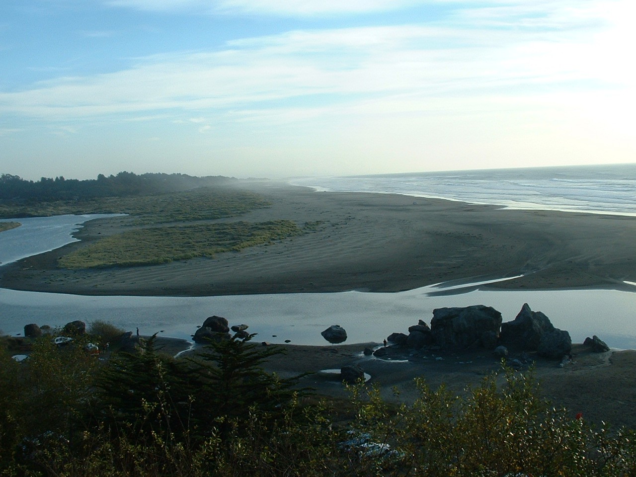 The Little River mouth and broad sandy shore at Moonstone Beach.