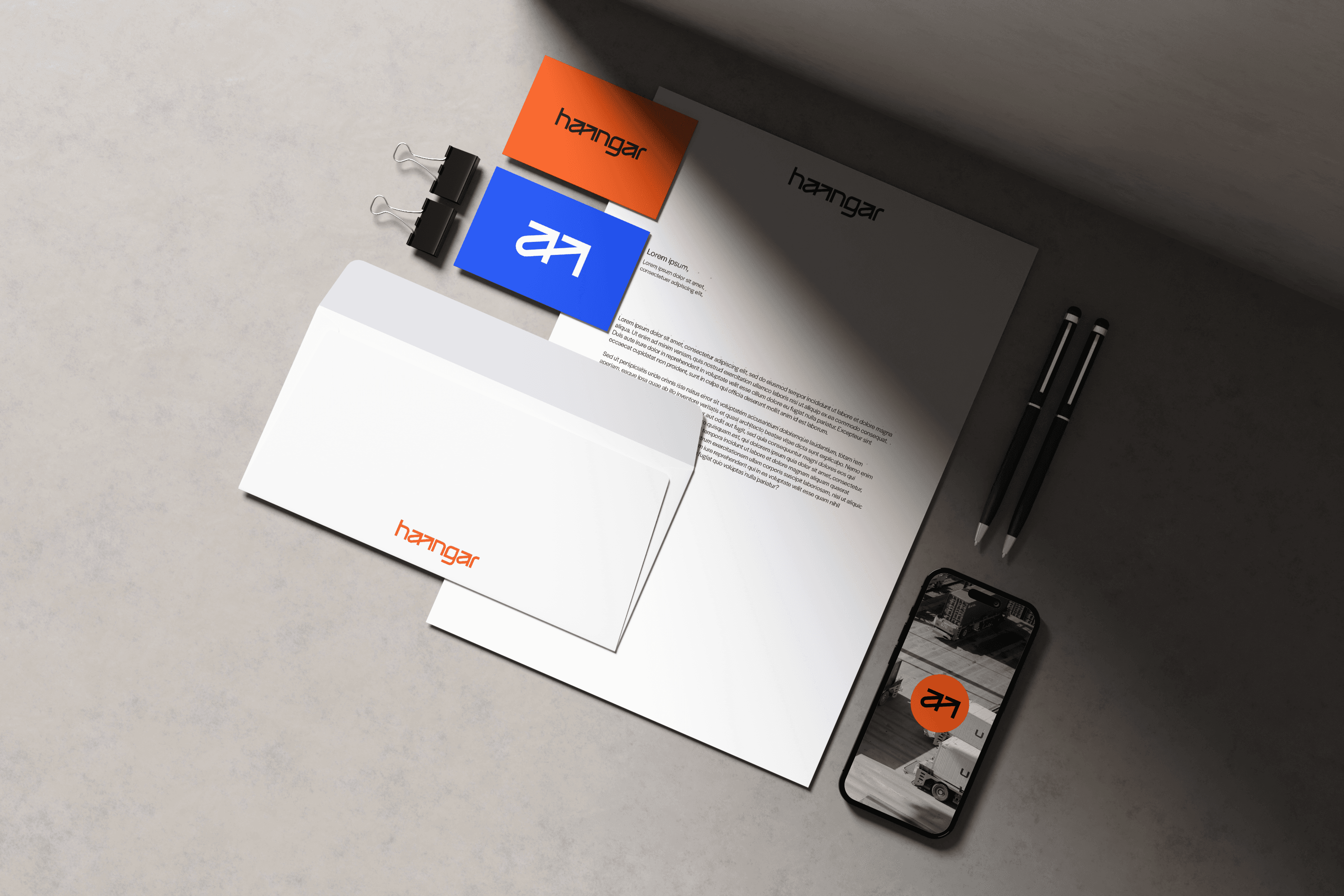 Haangar logistics brand identity across trucks, boxes and warehouse touchpoints