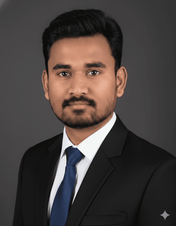 Young adult wearing a navy coat and white turtleneck, looking directly with a neutral expression. The background is plain and light-colored.
