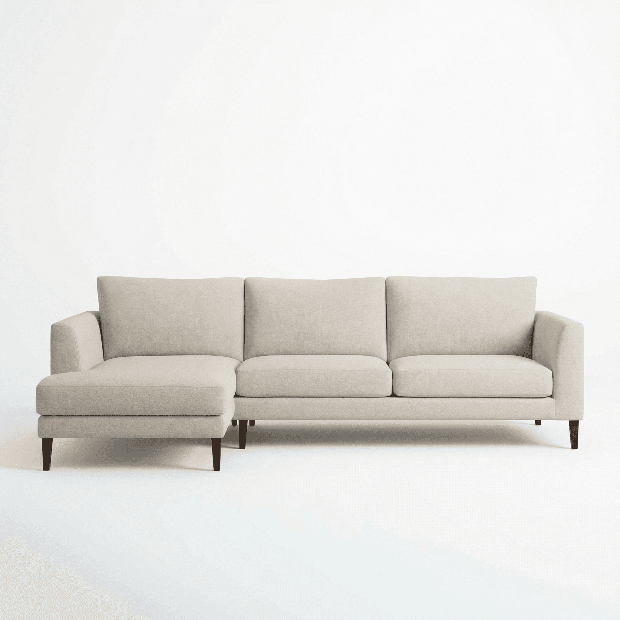 Contemporary upholstered sofa with slim legs and contrast patterned cushions