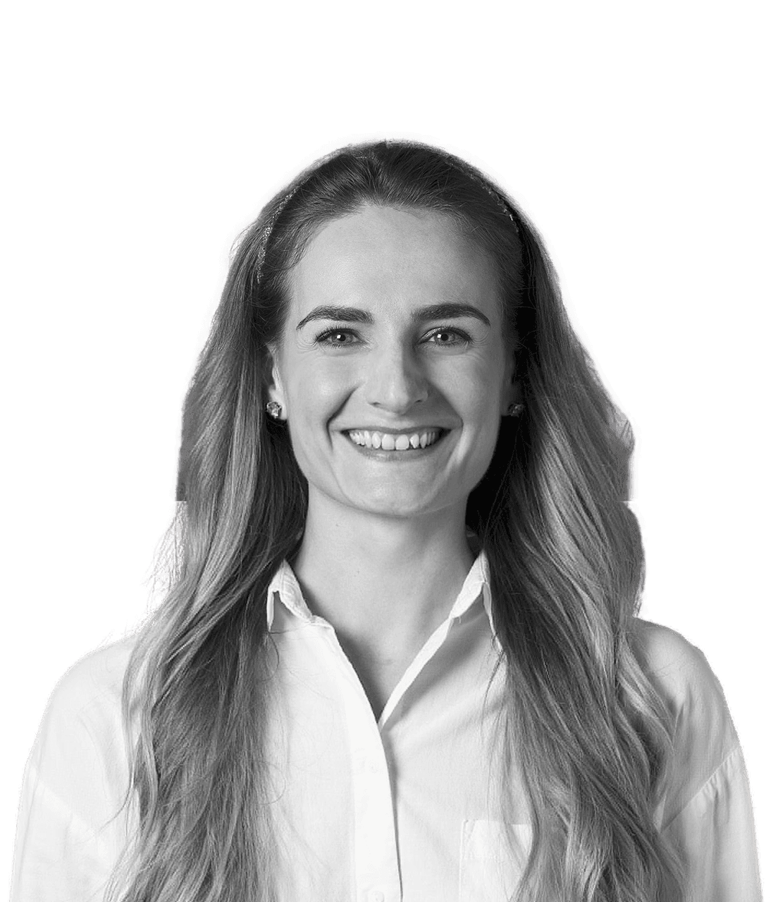 A woman with long, wavy hair smiles warmly, wearing a white button-up shirt, set against a neutral background.