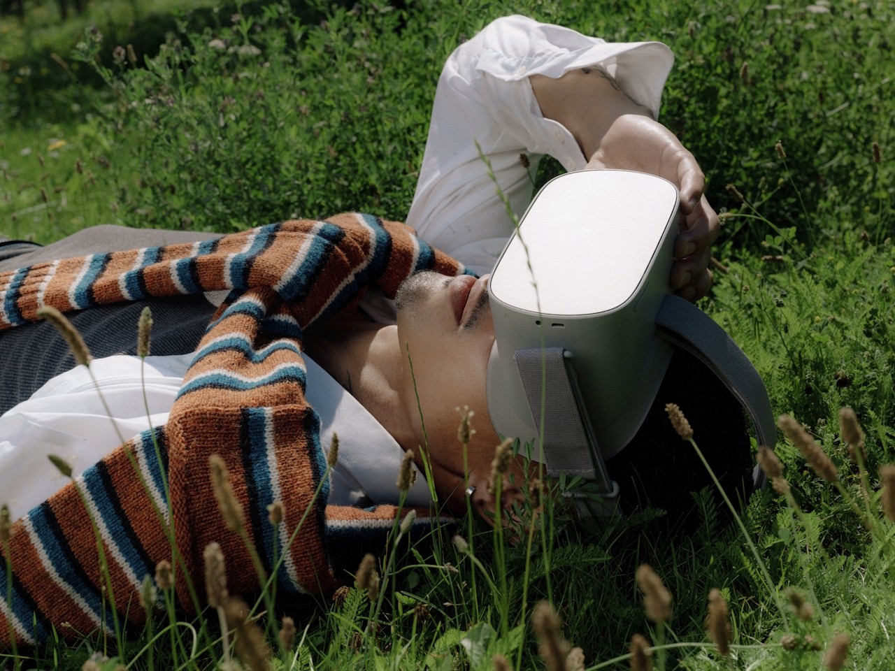 Guy laying on floor wearing VR headset