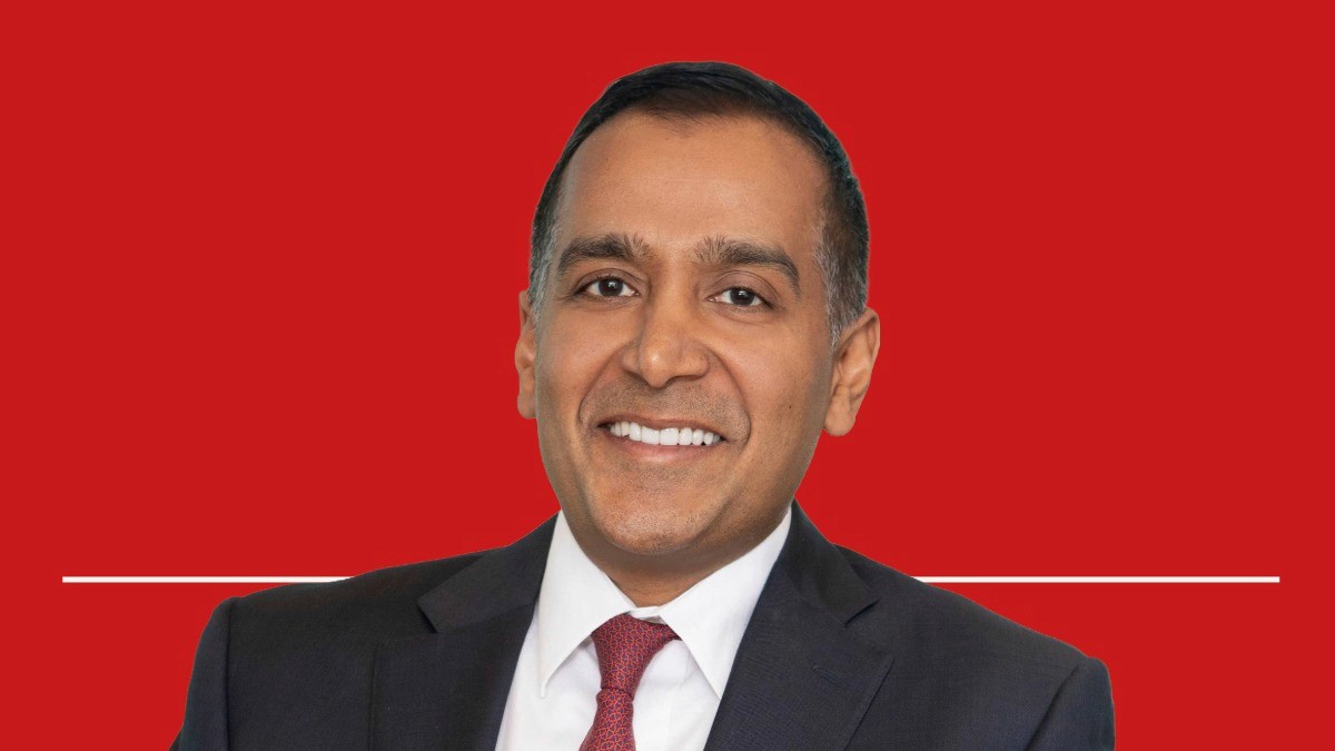 Image of Sachin Jain on a red background for the Value Health Voices Podcast