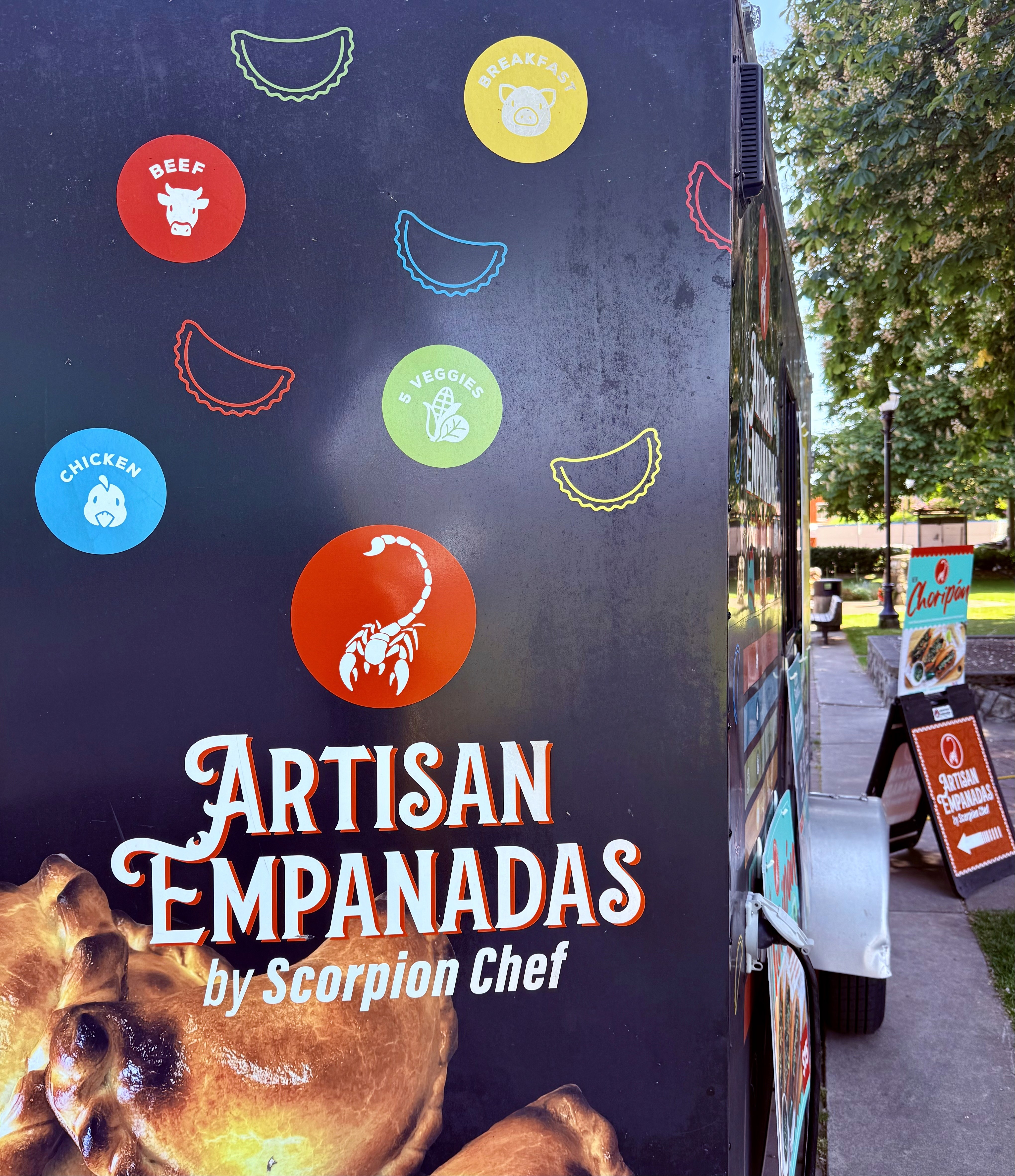 Scorpion Chef artisan empanadas food truck side panel showing beef chicken breakfast and five veggies flavours Vancouver Island BC