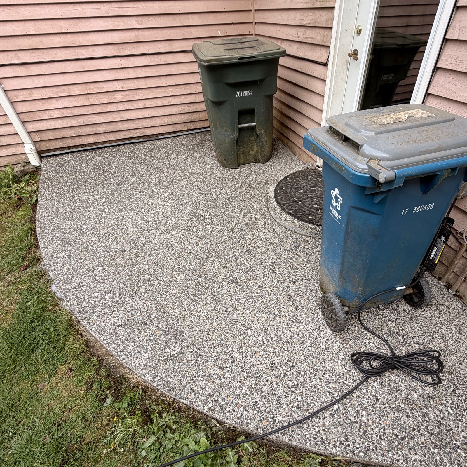 After: concrete patio pressure washing & moss removal by Peterson Property Services in Monroe, WA