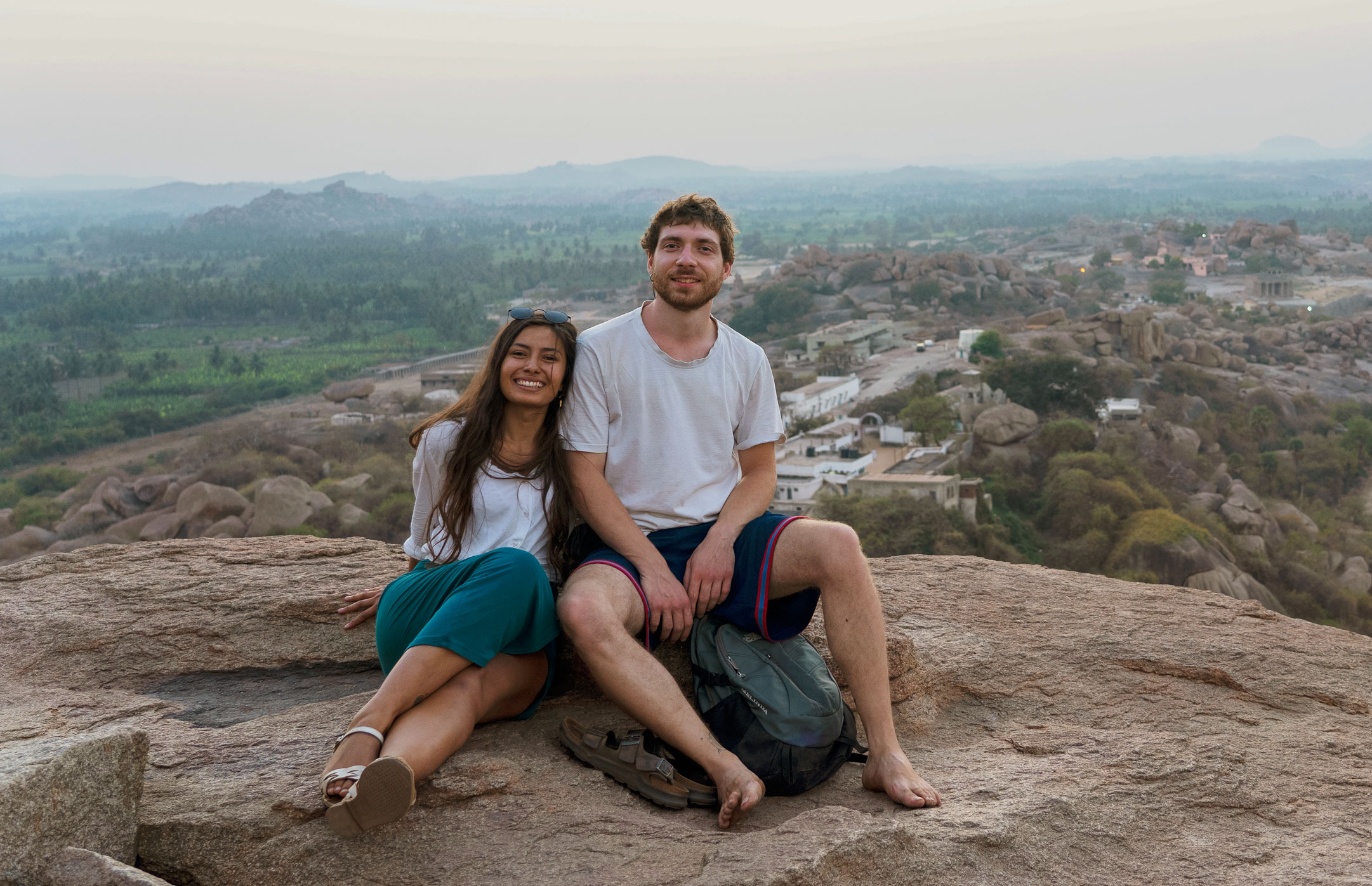 Pit and Gabriela on a rock up to a hill in Hampi, India