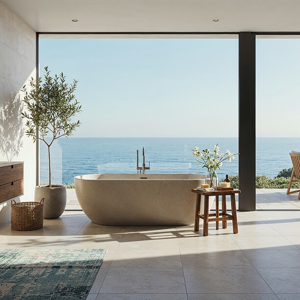 Stone soaking tub, floor-to-ceiling windows, and panoramic ocean view.