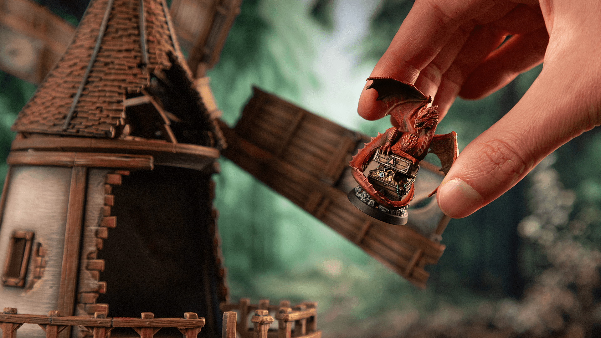 A person fingers reaching out to a miniature of an Troll