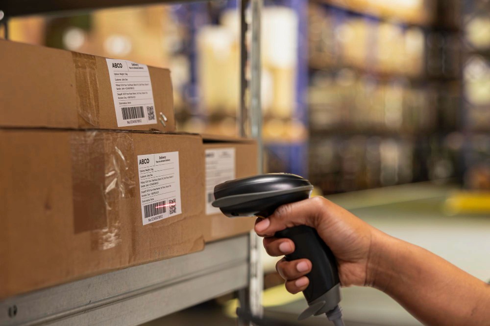 Warehouse worker scanning a box