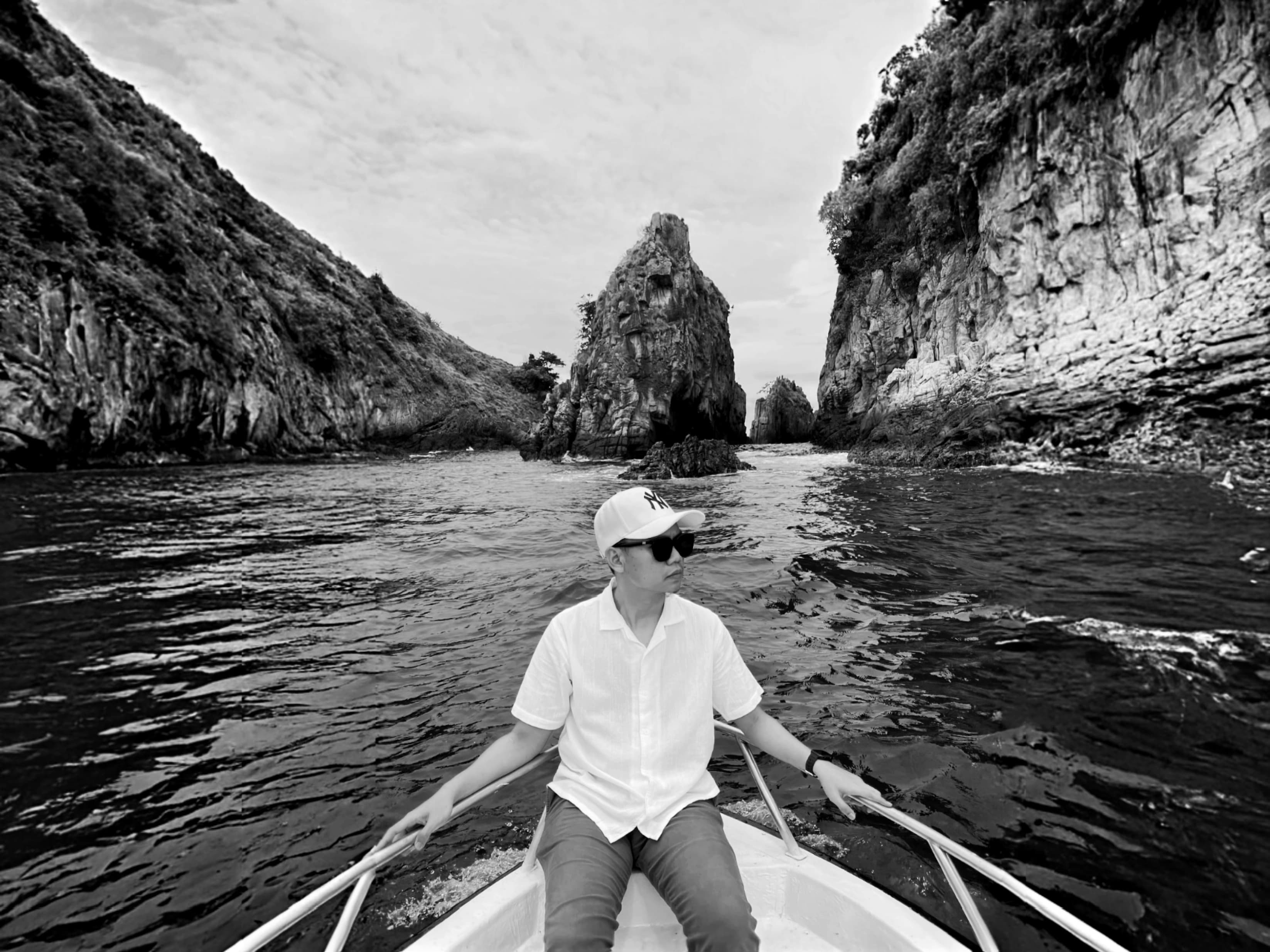 Peace Badejo, wearing sunglasses, looking to the left.