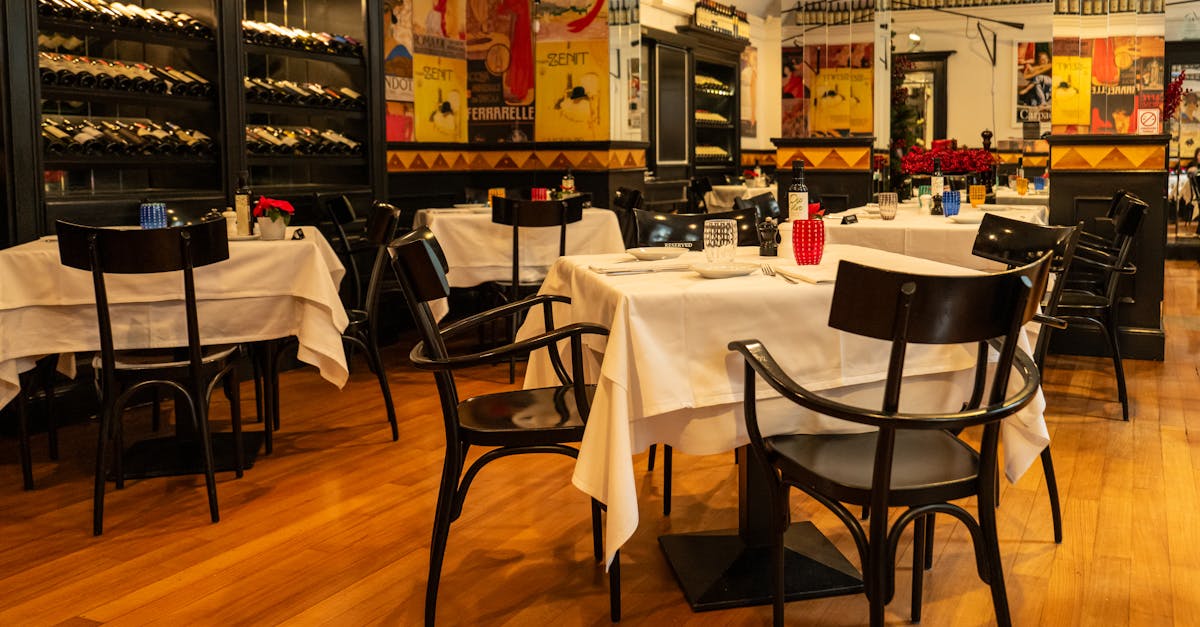 Chic dining space in Zagreb with neatly set tables and a prominent wine display, perfect for an upsc