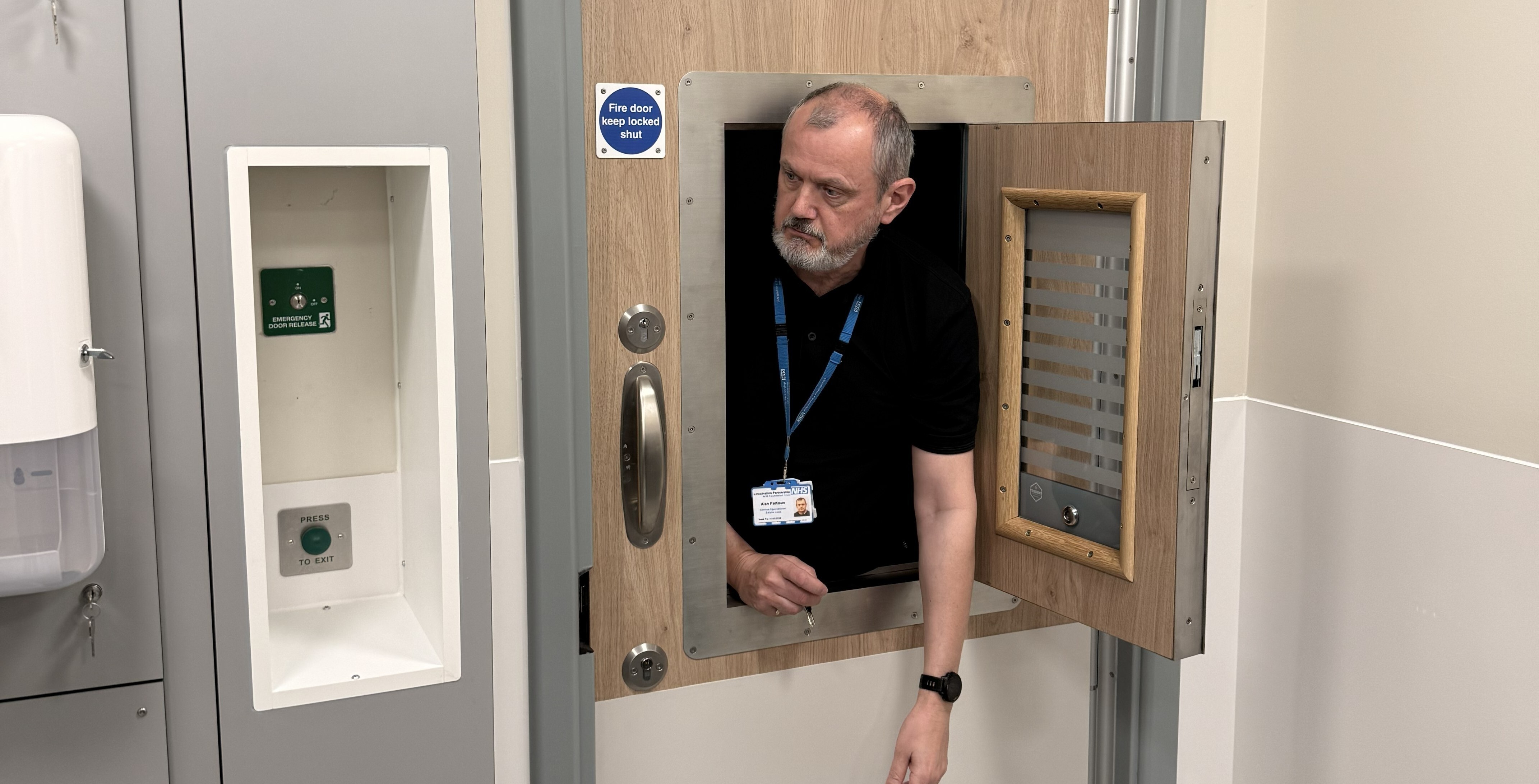 Clinical-Operational Estates Lead Alan Pattison demonstrating anti-barricade door features at Norton Lea