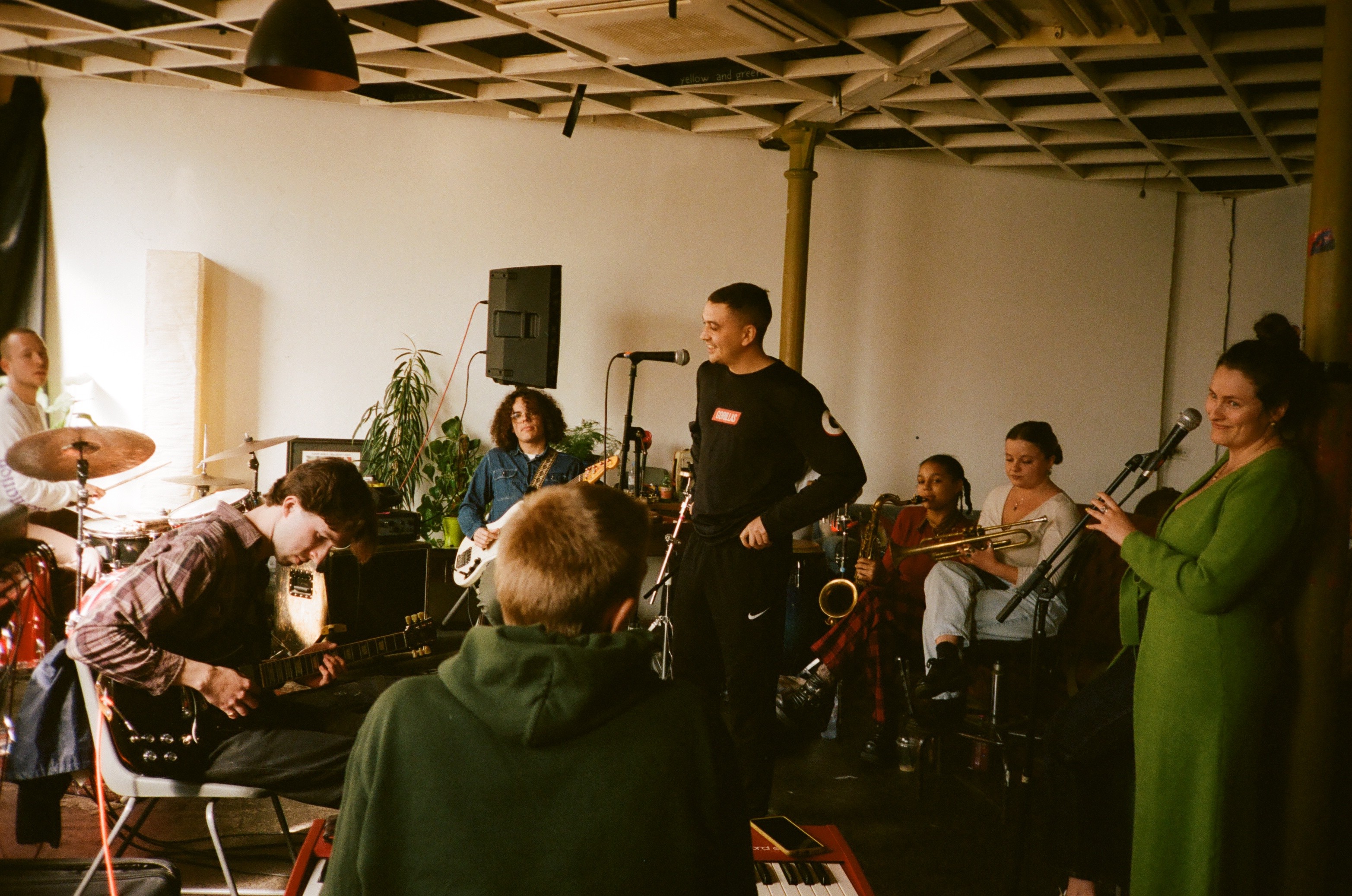 Musicians rehearsing together for Root 73's community event.
