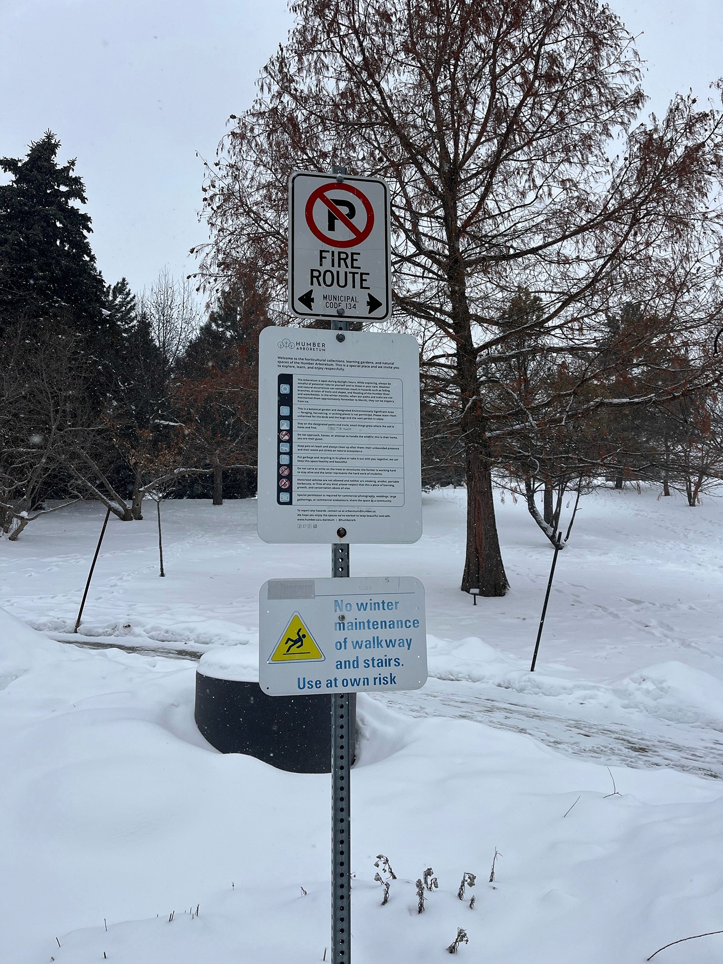 A close‑up of an informational panel titled ‘Visit the Centre for Urban Ecology,’ describing the building as the Arboretum’s environmental education centre that hosts programs, workshops, and community events.