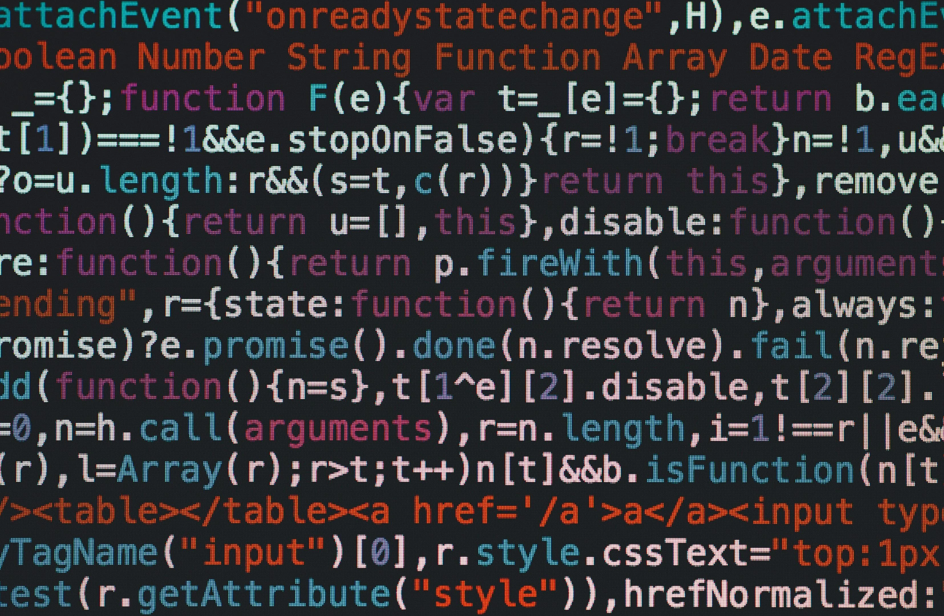 Close-up of colorful syntax-highlighted JavaScript source code on a dark background