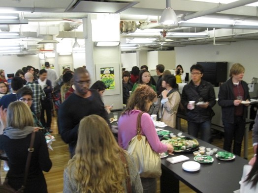 A group of people sitting in an event room and serving a Swedish bouffe.