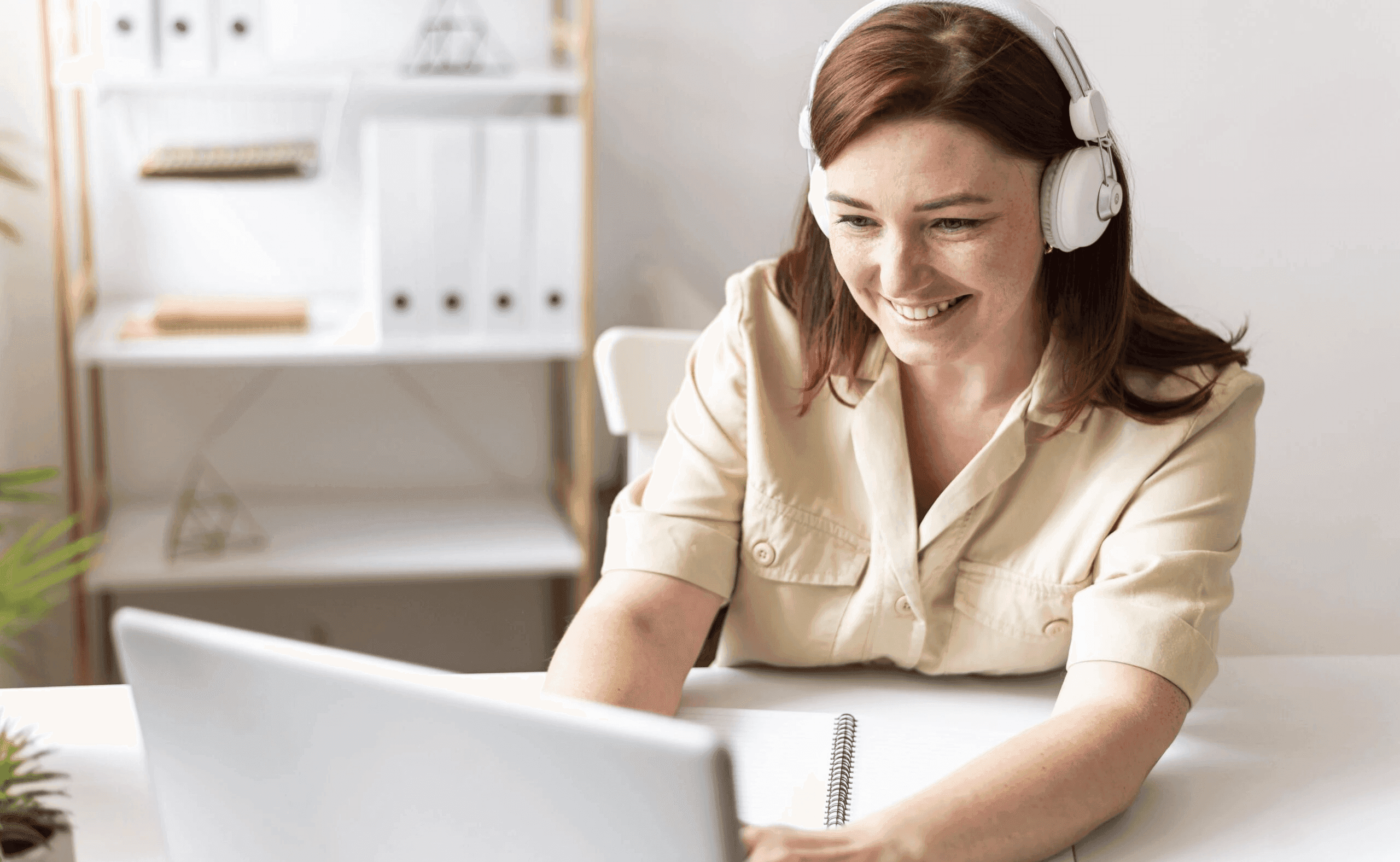  Woman taking online classes with headphones -  Online Spanish Courses for Adults