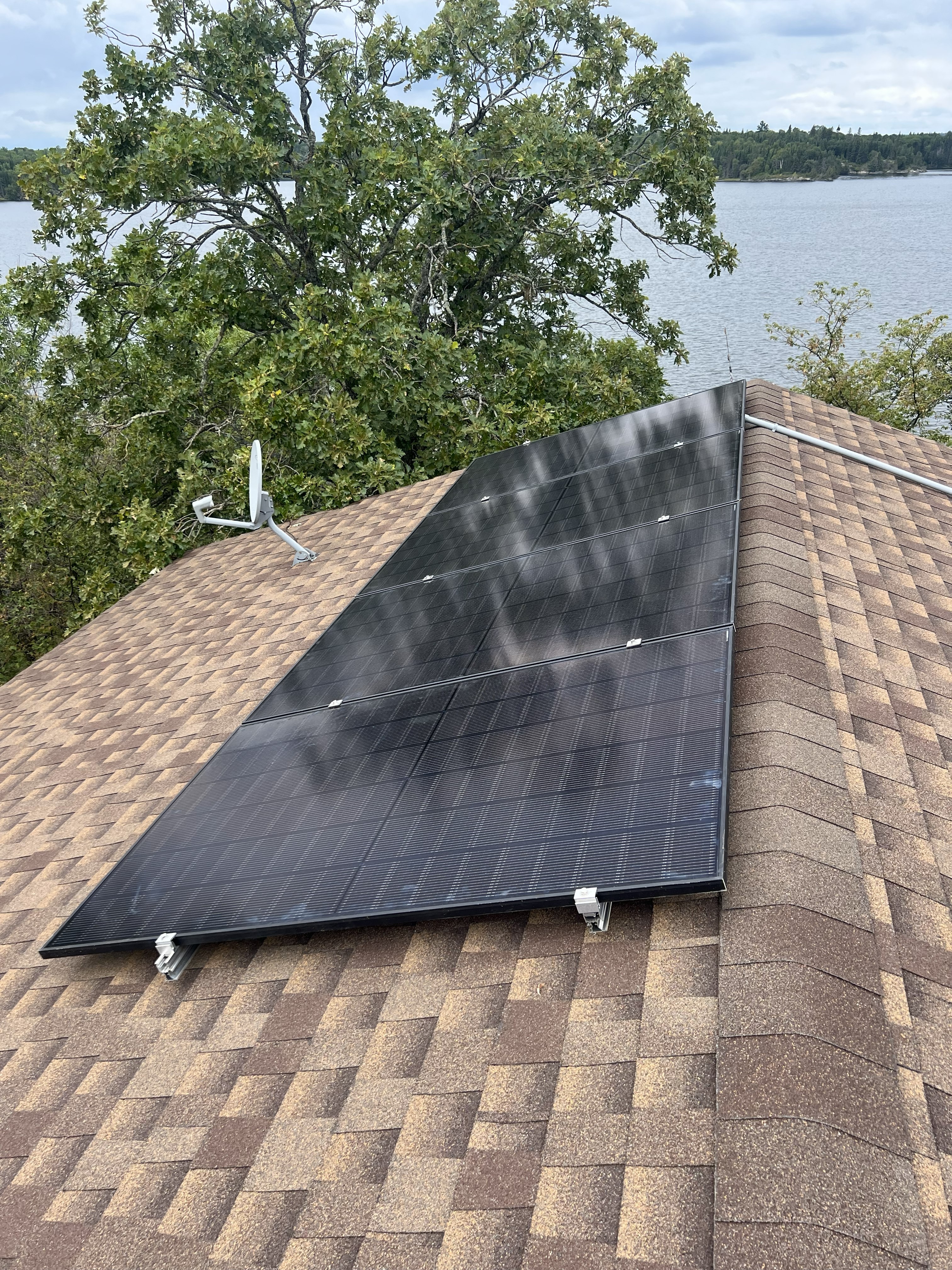 Cabin rooftop solar panel installation - K and C solar