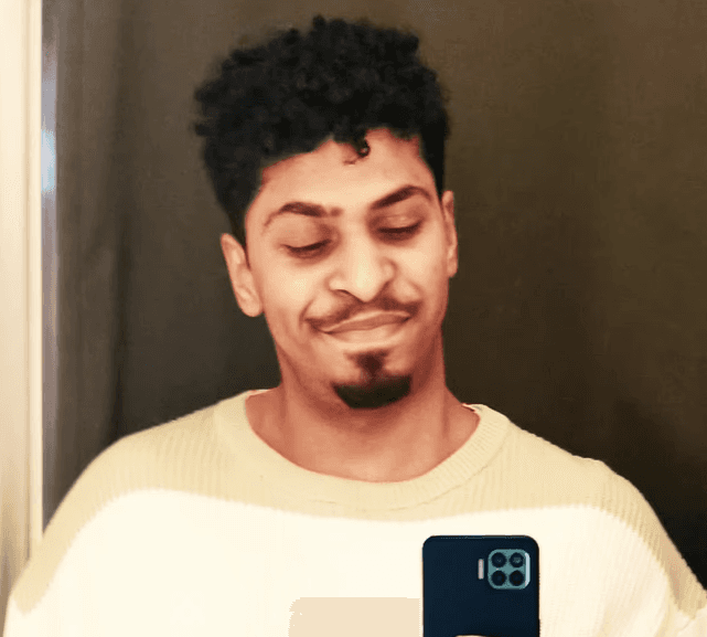 A portrait of a young man smiling