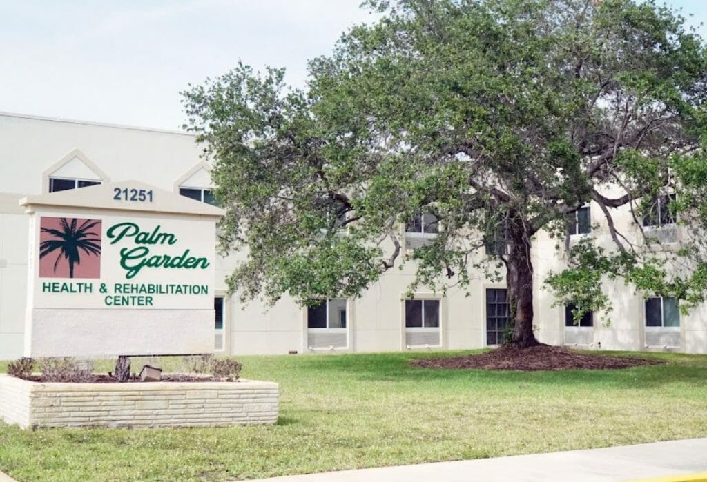 A group of people praticing yoga on the beach in the morning