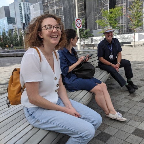 Happy visitors on a bench