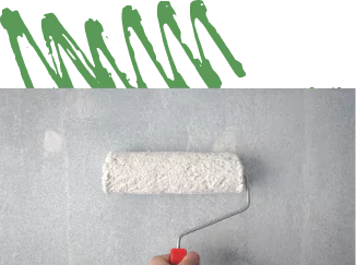 Paint roller on a bathroom wall