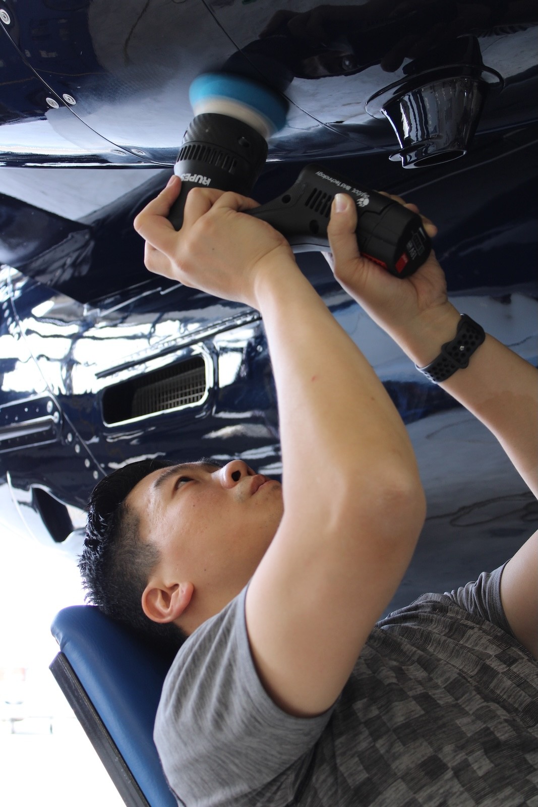 Aircraft detailer applying protective treatment to a private aircraft