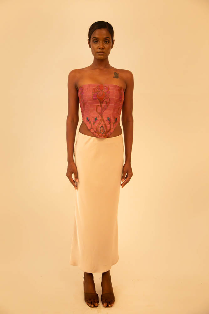 Handcrafted strapless corset made from upcycled vintage silk sari, a structured silhouette, celebrating artisanal craftsmanship and conscious design.