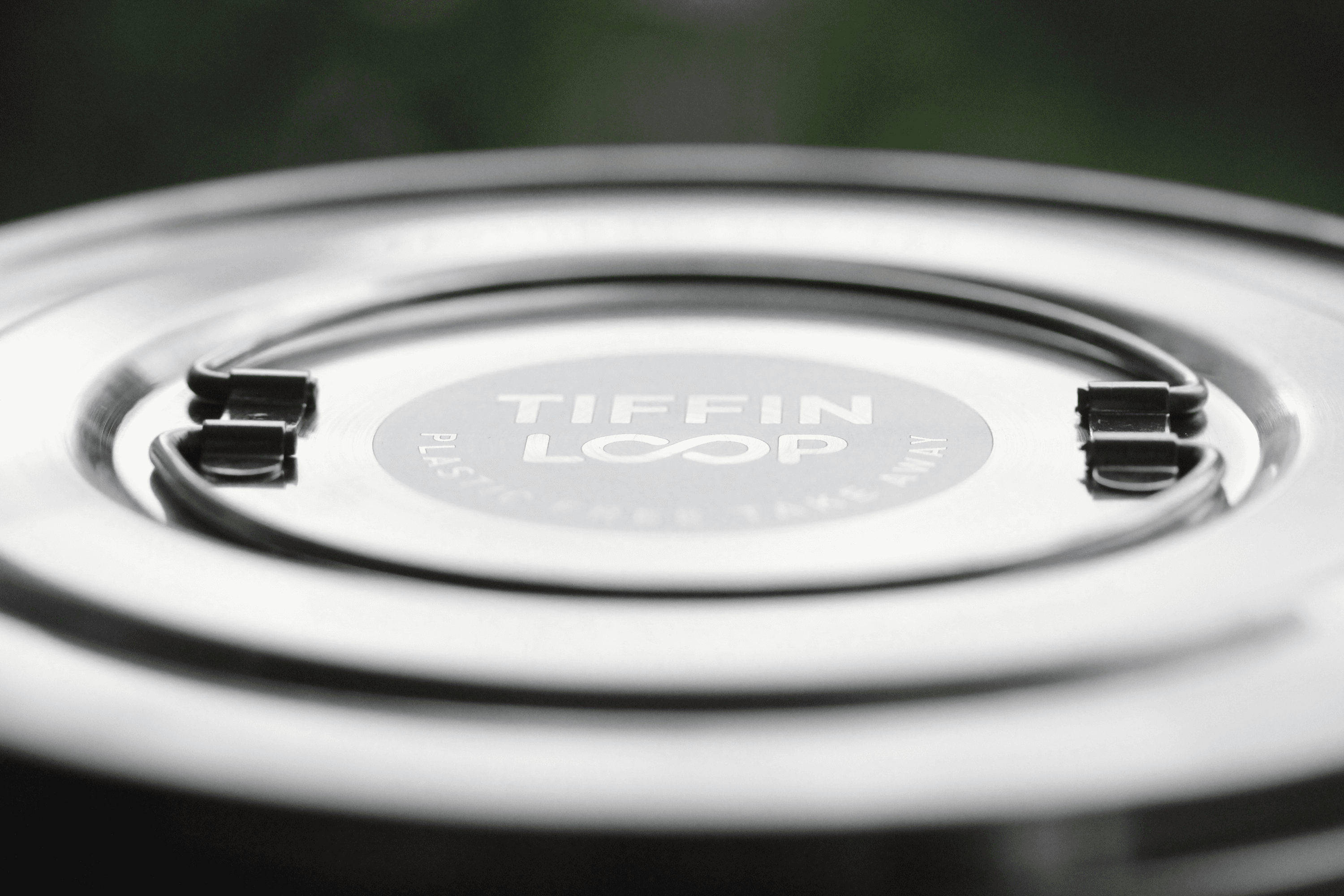Tiffin Loop logo on metal lid with handles.