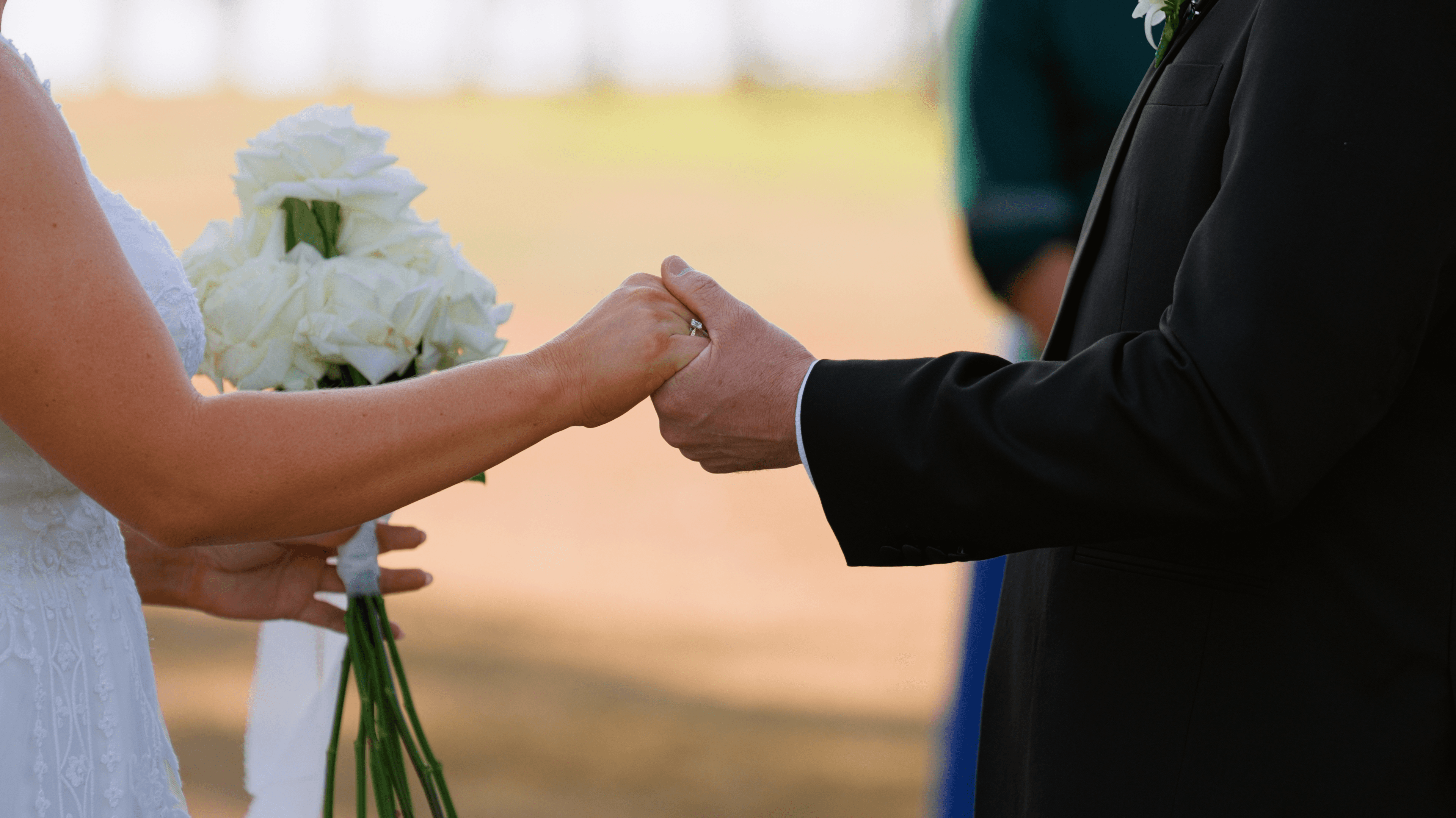 Lauren & Mike holding hands during their ceremony at The Overflow Estate in Queensland Scenic Rim.