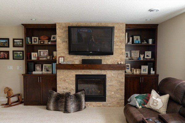 Family room dark wood entertainment cabinets