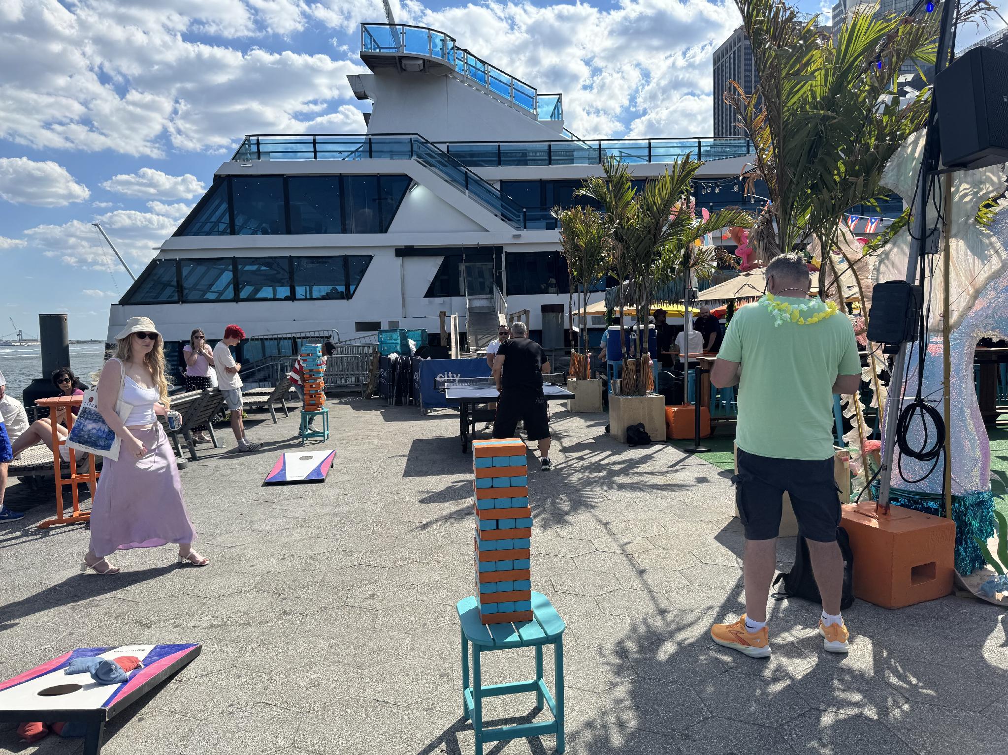 Community gathered at Pier 15 playing various lawn games