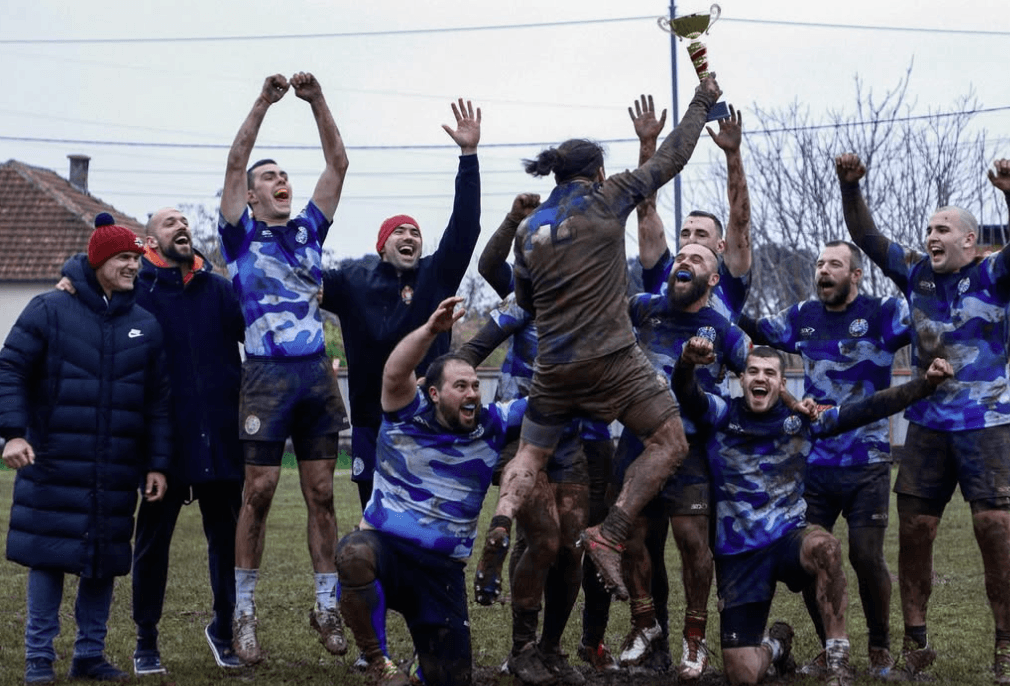 players celebrating with trophy