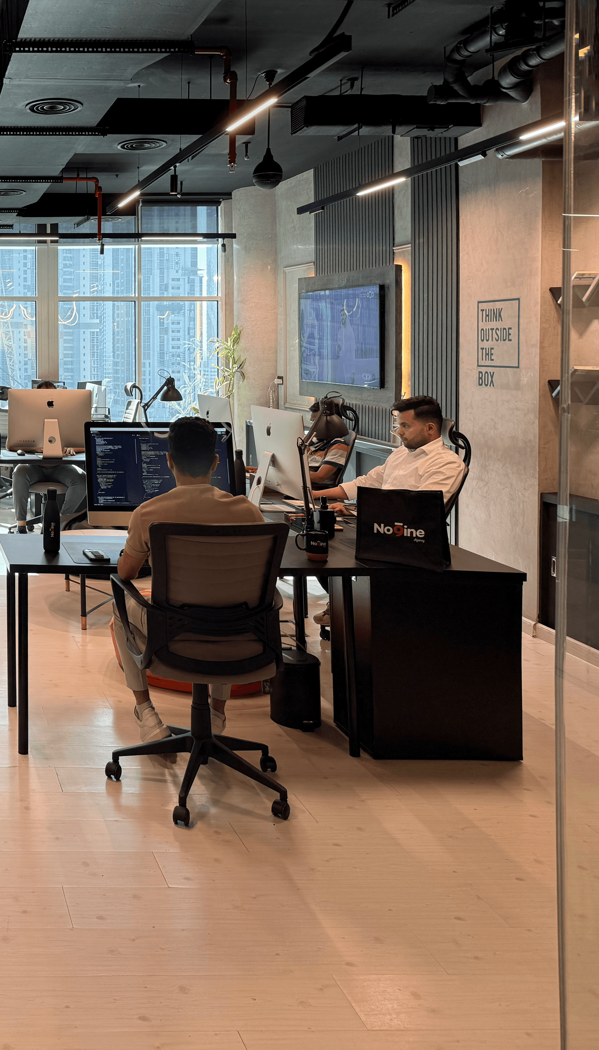 Team working in an office watching at a presentation