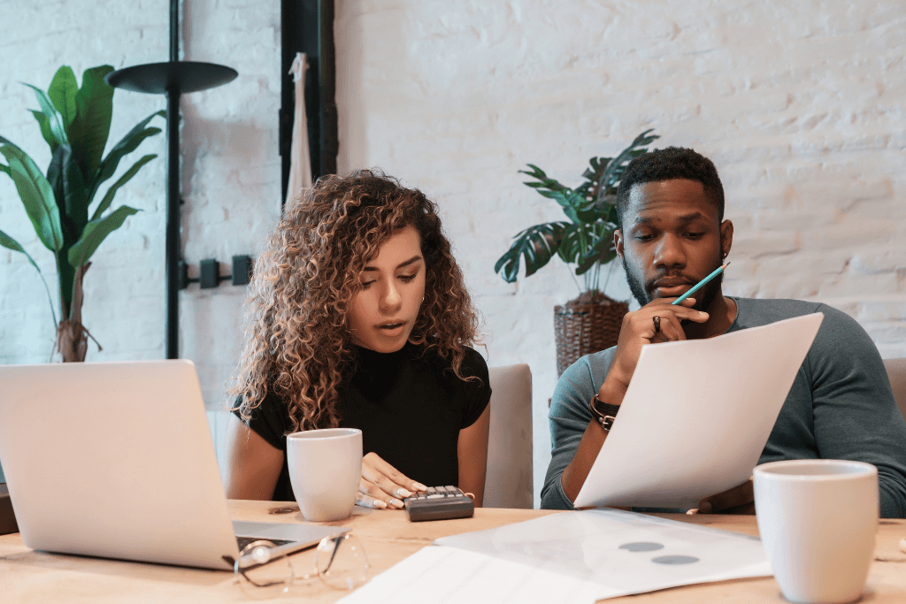 Young Couple Planning Monthly Budget Together