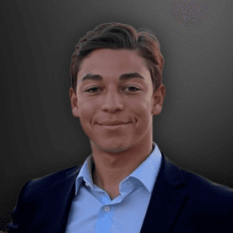 man standing near white wall