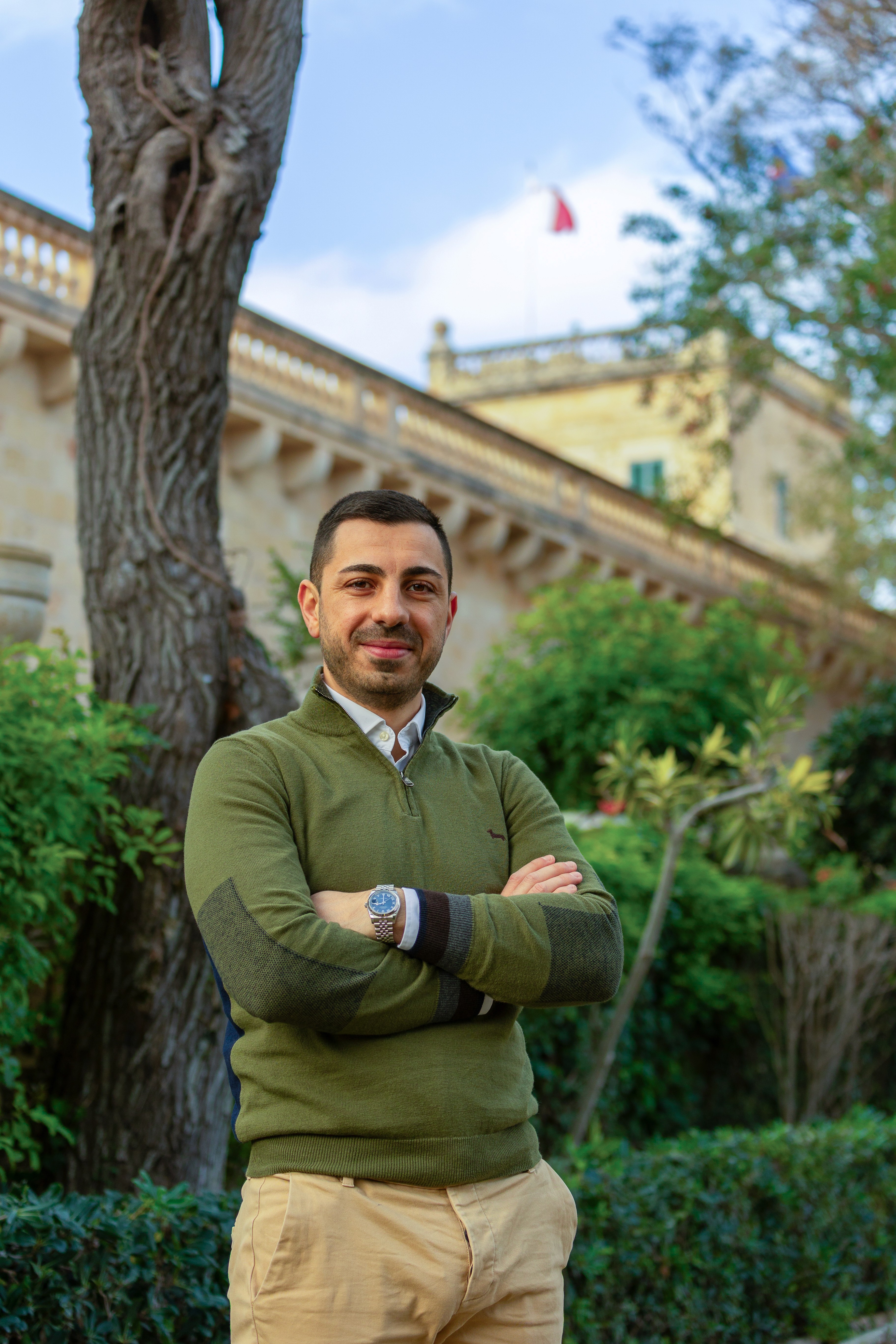 woman holding a phone and man looking at the phone. both are smiling
