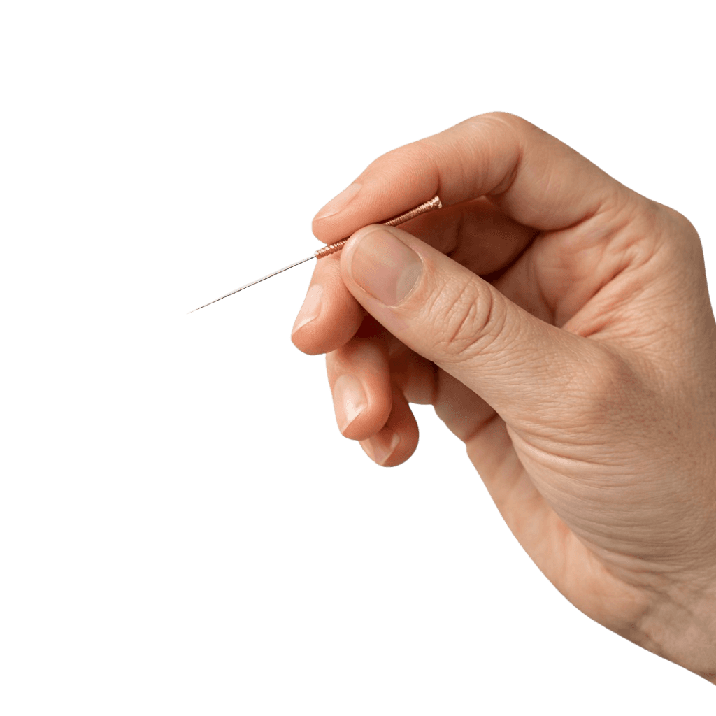 Hand holding acupuncture needle