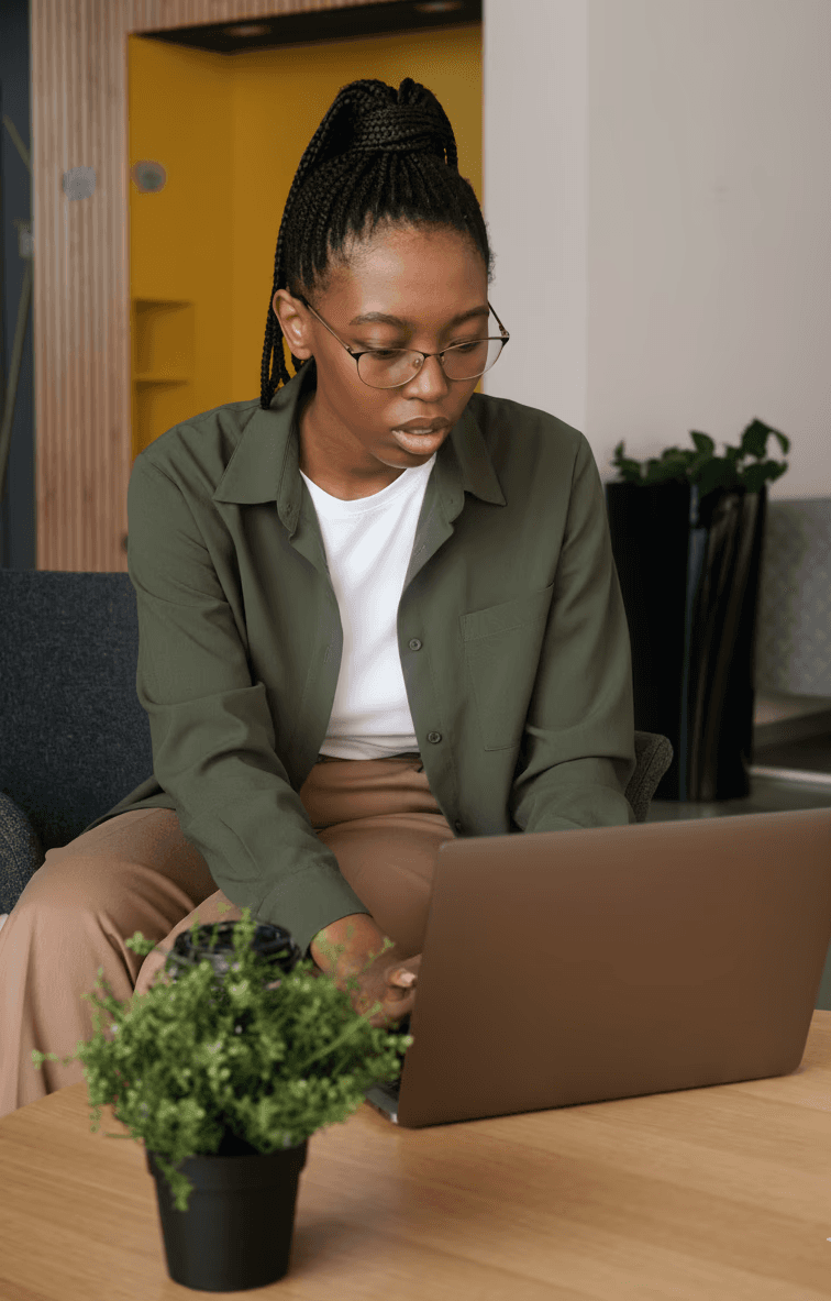 a man looking at a piece of art on a table