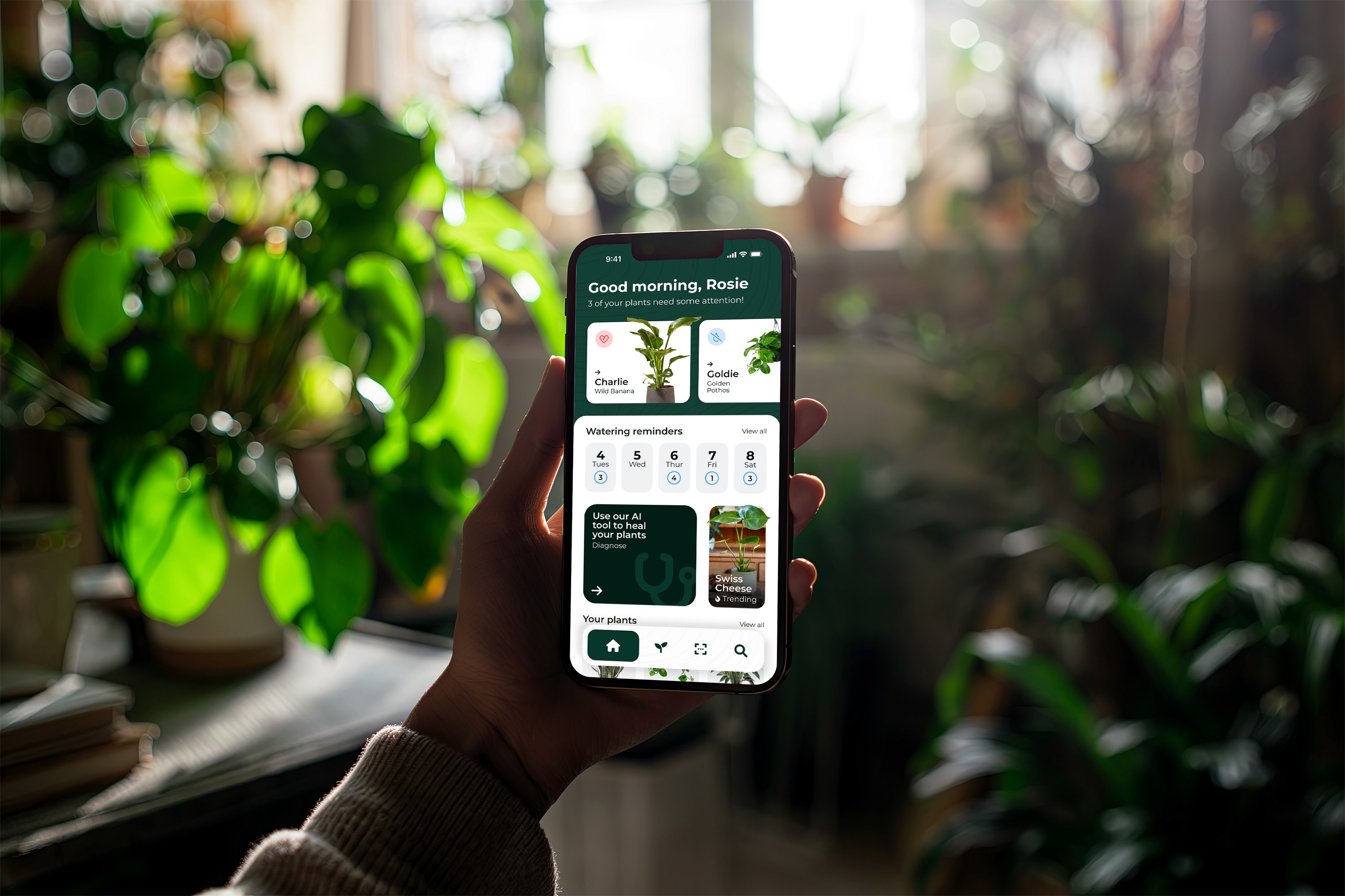 Hand Holding Mobile with plant filled background