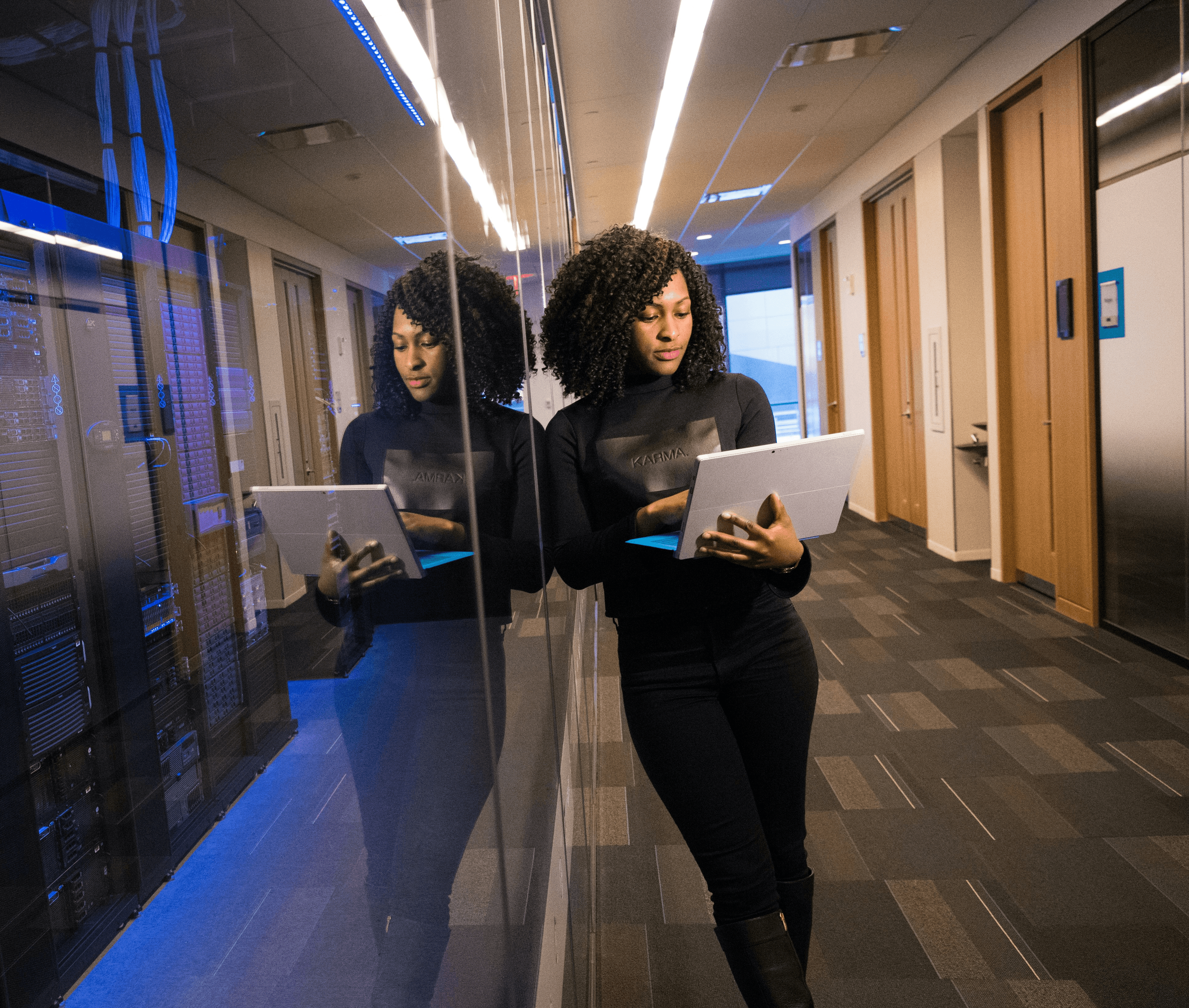 woman in black top using Surface laptop